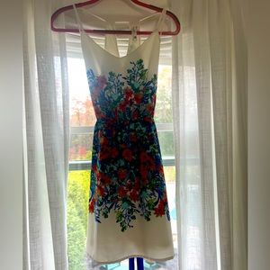 White dress with colorful flowers. Perfect for a spring/ summer wedding.